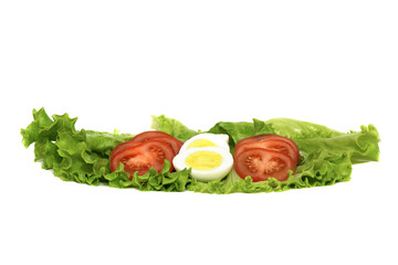 red, ripe tomatoes and boiled chicken eggs on a fresh lettuce leaf, isolated on a white background