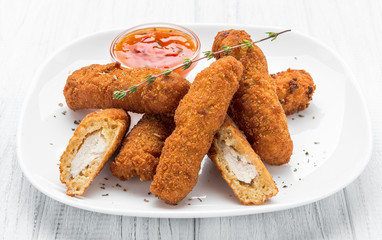Fried chicken nuggets with ketchup on a plate