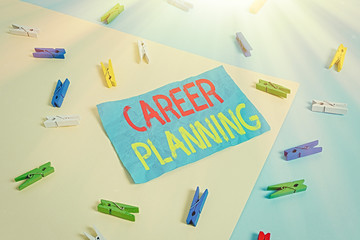 Conceptual hand writing showing Career Planning. Concept meaning Strategically plan your career goals and work success Colored clothespin paper reminder with yellowblue background