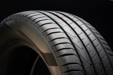 new summer tire on a black background