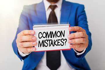 Writing note showing Common Mistakes Question. Business concept for repeat act or judgement...