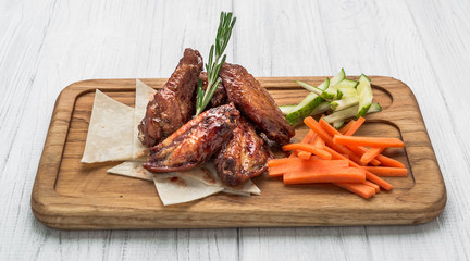 Spicy Homemade Buffalo Wings with Dip on wooden