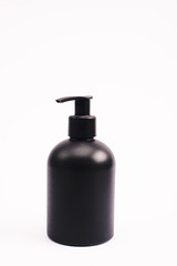black bottle with body lotion isolated on white