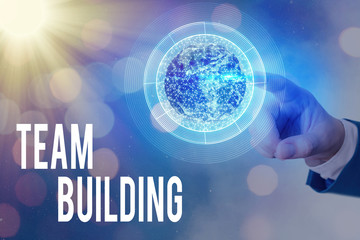 Writing note showing Team Building. Business concept for various types of activities used to...