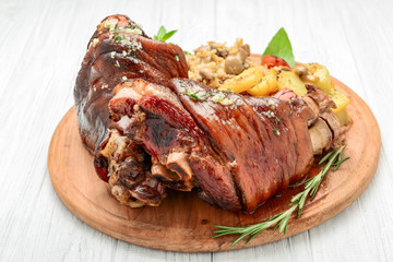 Roaster Pork Knuckle with savoy cabbage and baked potatoes