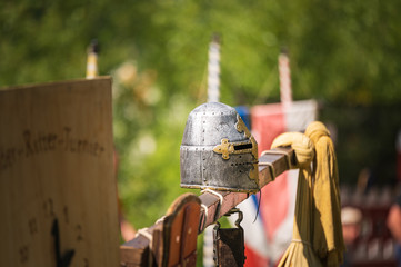 Metal helmet of a knight in a medieval festival on a sunny weekend