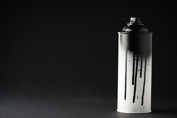 graffiti paint can on black with copy space