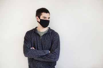 Obraz premium medicine and health care concept - close up of caucasian man in protective facial mask over grey background. Horizontal image with copy space