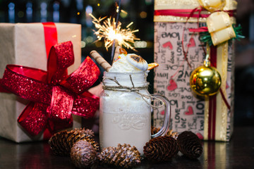 milkshake with marshmallows, waffle tubes and sparklers and gifts