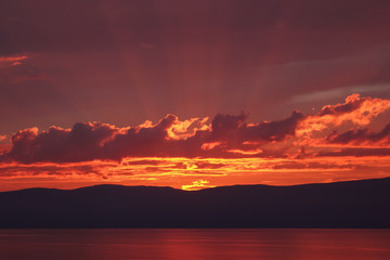 Magnificent sunset in the summer on Lake Baikal.
