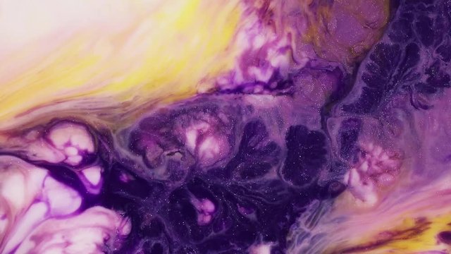Abstract texture flowing in chaotic. Fluid art painting. Modern fluid painting artwork. Abstract mixture paint with iridescent mixing of paints. Purple, yellow and gold iridescent artwork