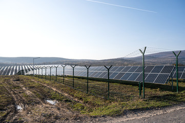 View of a solar energy station on a field.