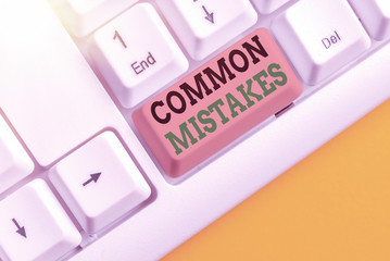 Writing note showing Common Mistakes. Business concept for actions that are often used...