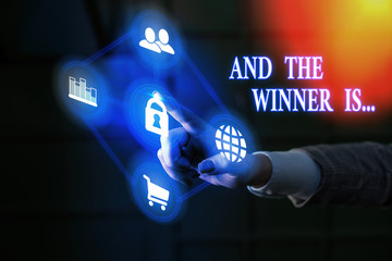 Conceptual hand writing showing And The Winner Is. Concept meaning announcing a demonstrating or...