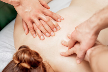 Fototapeta na wymiar Massage with four hands.