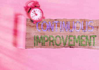 Conceptual hand writing showing Continuous Improvement. Concept meaning ongoing effort to improve...