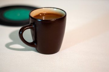 cup of coffee on vinyl background