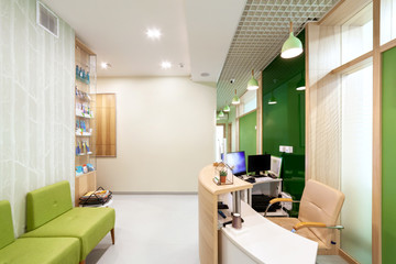 Lobby entrance with reception desk in a dental clinic.