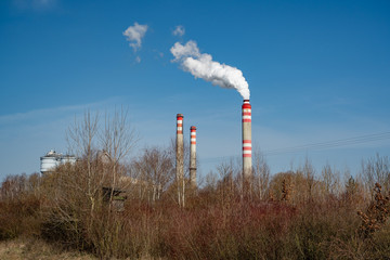 Fototapeta na wymiar power plant chimney producing the smoke
