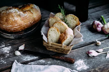 Tuinposter Wheat flour bread on the table © elenavah