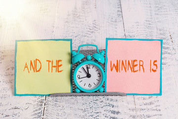 Handwriting text And The Winner Is. Conceptual photo announcing a demonstrating or thing that wins...