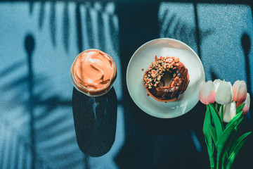 flat lay favorite and trend of summer drink from dalgona or frothy coffee on classic blue and shadow of palm tree background