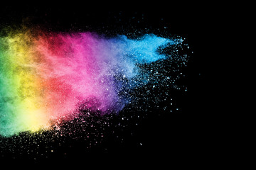 Freeze motion of colorful color powder exploding on black background.  Paint Holi.Indian festival...