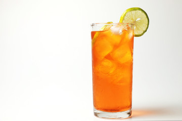 Iced tea lemon juice fresh drink on white bakcground, Isolate black tea and lime lemon in the glass cocktail drink.