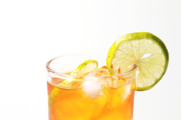 Iced tea lemon juice fresh drink on white bakcground, Isolate black tea and lime lemon in the glass cocktail drink.