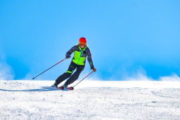 Fototapeta na wymiar A girl skiing on the ski slope