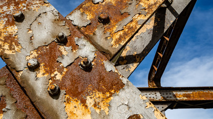 Close up of rust of two diagonally joined beams 