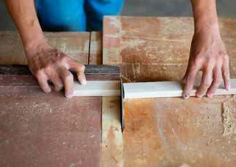 The hands of people working with dangerous machinery