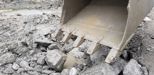 excavator with loading shovel on construction site