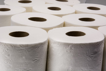 Full toilet paper rolls isolated on white background