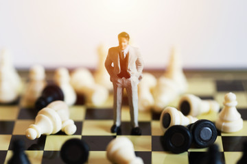 Doll business man stand with any Chess piece, Business concept for leadership and success. business and finance concept.
