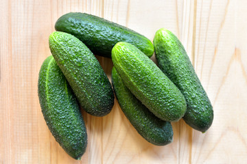 Fresh cucumbers on a wooden table