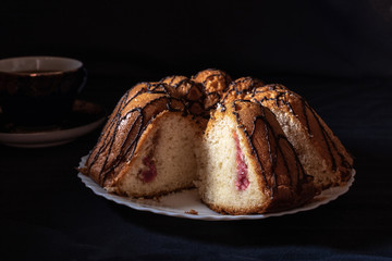 Homemade cake with strawberry jam and cream
