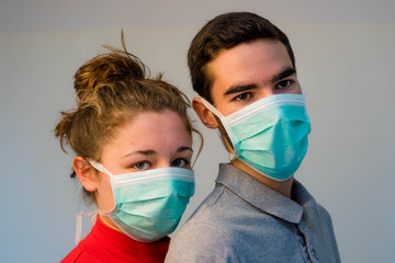 young couple wearing protective masks