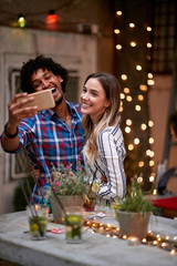 Female and male making selfie