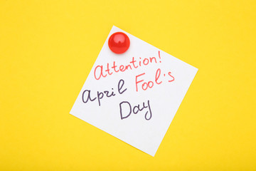 Text Attention April Fool's Day on yellow background
