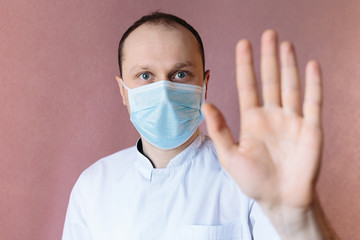 Portrait of a doctor in surgical mask. Stop epidemic. Epidemic infection. Stop coronavirus. 