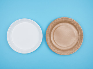 Disposable tableware on a blue background.