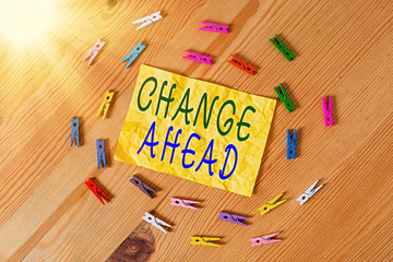 Writing note showing Change Ahead. Business concept for to replace with or exchange for another...