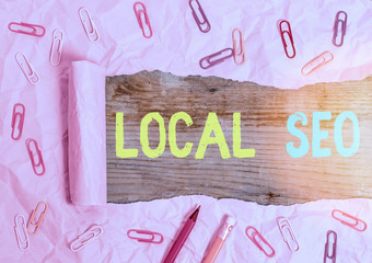 Writing note showing Local Seo. Business concept for helps businesses promote products and services...