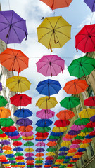 Fototapeta na wymiar hanged umbrellas on a pedestrian street in downtown
