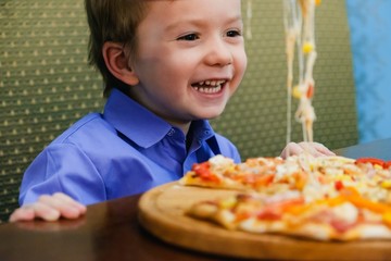 Hungry child eat slice pizza,  meal.Hungry child eat slice pizza,  meal.