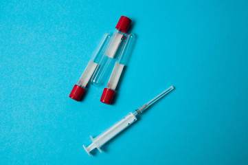 Coronavirus medicine and treatment concept. Syringe and blood test tubes