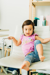Fototapeta premium Toddler Girl Eating Banana Muffin