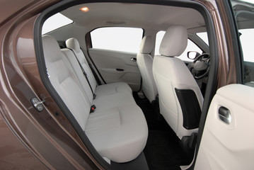 the white rear seat of a luxury passenger car - 333495283