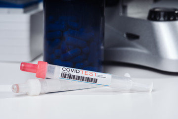 Coronavirus COVID-19 vaccine glass bottle in the laboratory. Cure for coronavirus un a test tube....